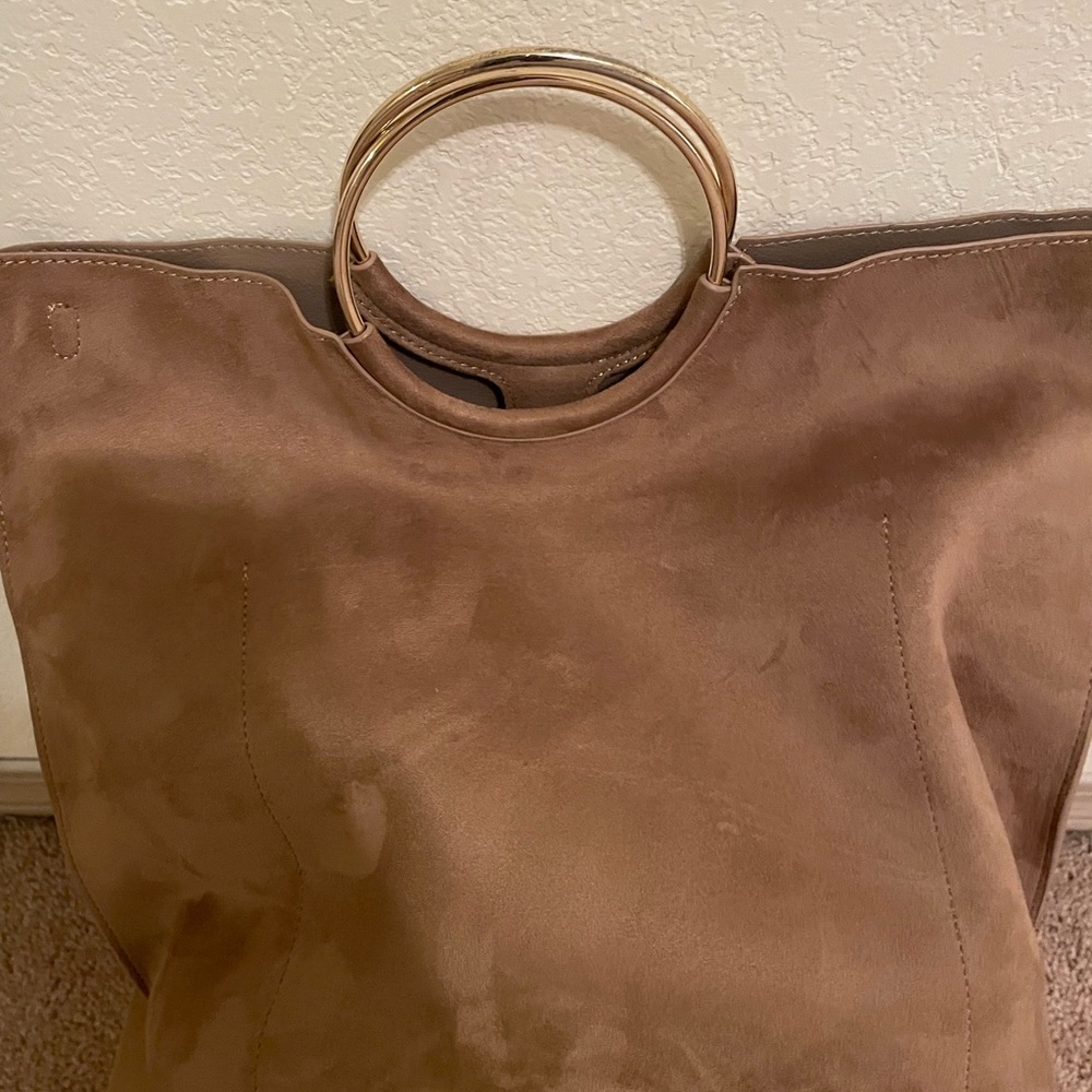 New York and company bag. Tan in color
